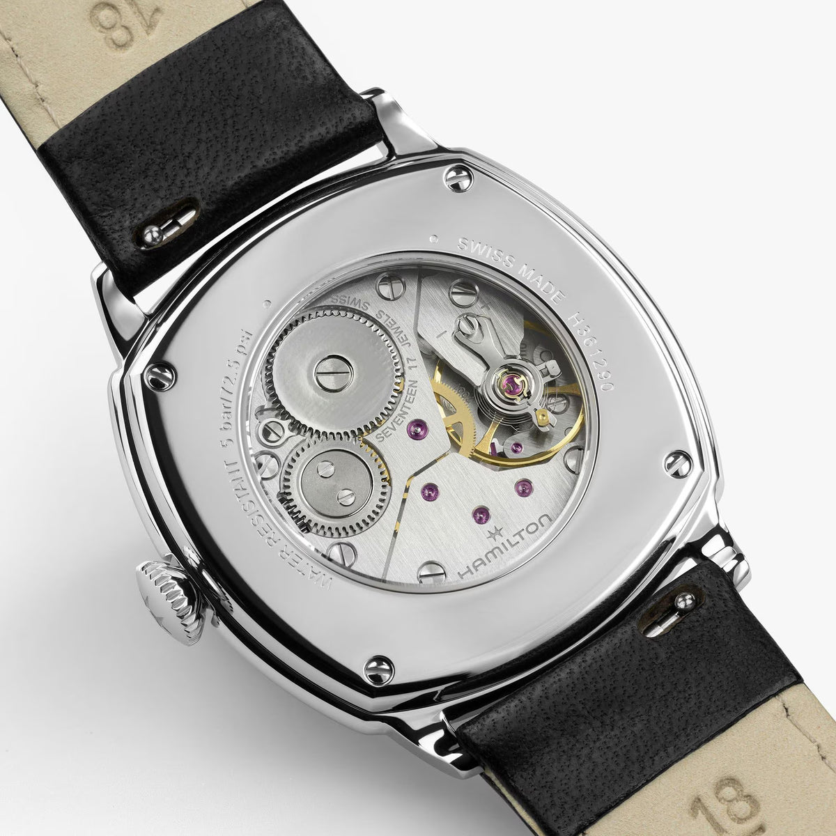 Hamilton American Classic Cushion Mechanical Unisex 34mm Watch H36129730 features an exhibition case back that reveals the H-42 hand-wound movement. The see-through back shows the mechanical detail behind the 57-hour power reserve.