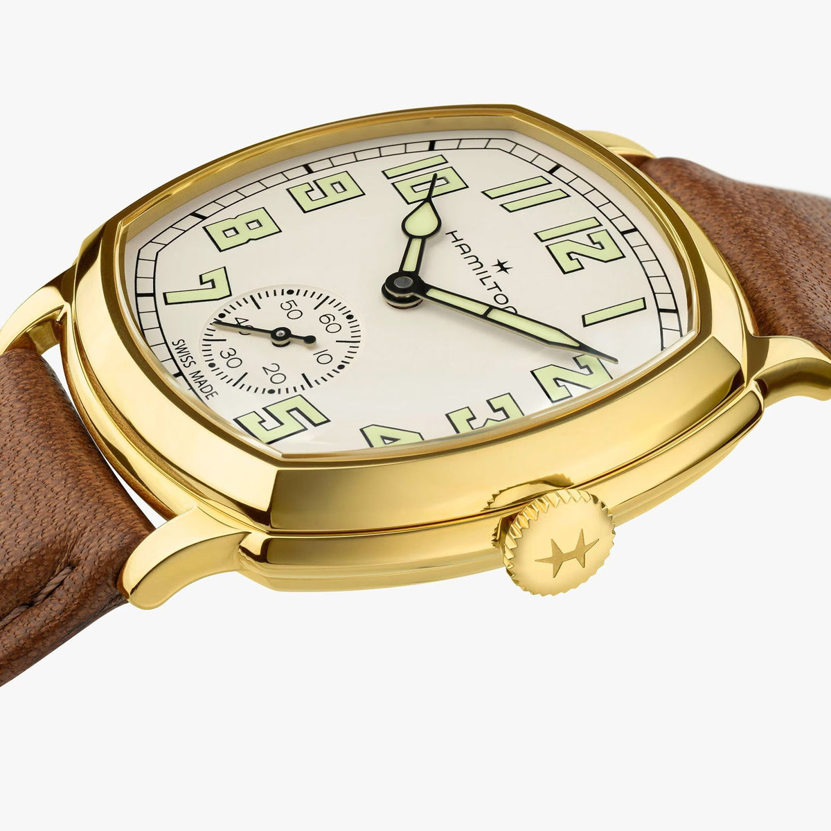 Hamilton American Classic Cushion Mechanical Unisex 34mm Watch H36139520 is shown from the side, displaying the slim yellow gold PVD case and crown. The brown leather strap extends from the lugs beneath the sapphire crystal.