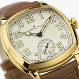 Hamilton American Classic Cushion Mechanical Unisex 34mm Watch H36139520 is shown in close up, revealing the Arabic numerals, railway minute track and small seconds sub-dial. The slim hands stand out against the beige dial.