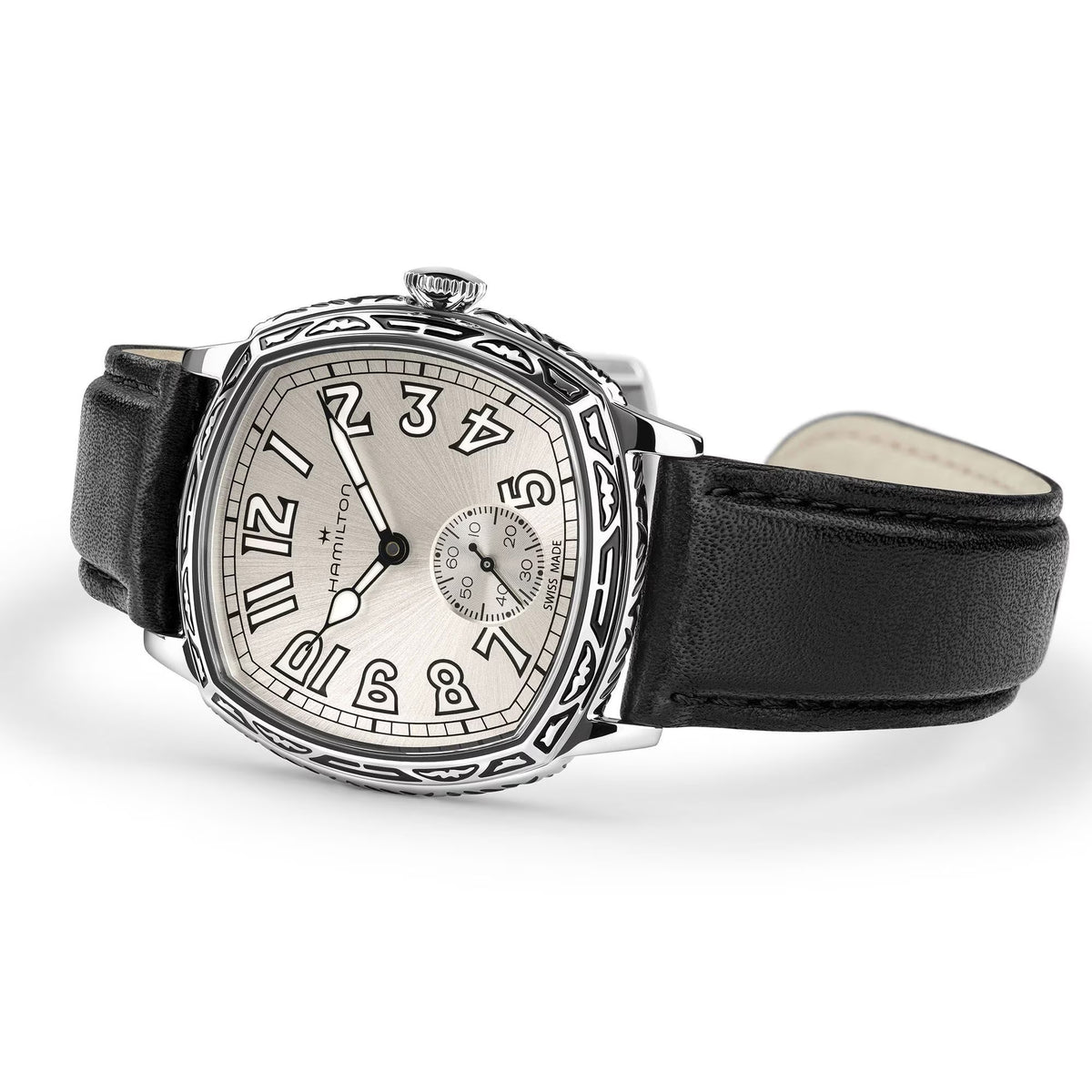 Hamilton American Classic Cushion Mechanical Unisex 34mm Watch H36149710 is captured at a 3/4 angle, showing the white dial, steel case and black leather strap together. The angle highlights the soft cushion shape and the engraved case finish.