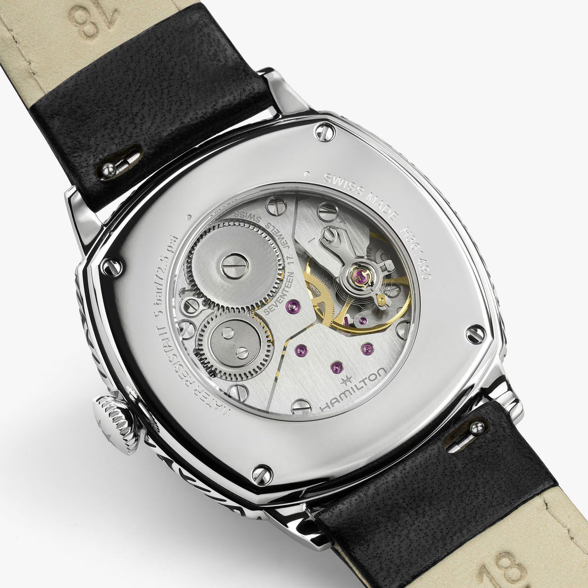 Hamilton American Classic Cushion Mechanical Unisex 34mm Watch H36149710 features an exhibition case back that reveals the H-42 hand-wound movement. The see-through back shows the mechanical detail behind the 57-hour power reserve.