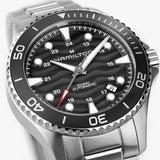 Hamilton Khaki Navy Scuba Auto 40mm Watch H82415130 is shown at a 3/4 angle, highlighting the sapphire crystal, wave-textured black dial, and unidirectional bezel together. The angle showcases the watch's dynamic, diving-inspired design.
