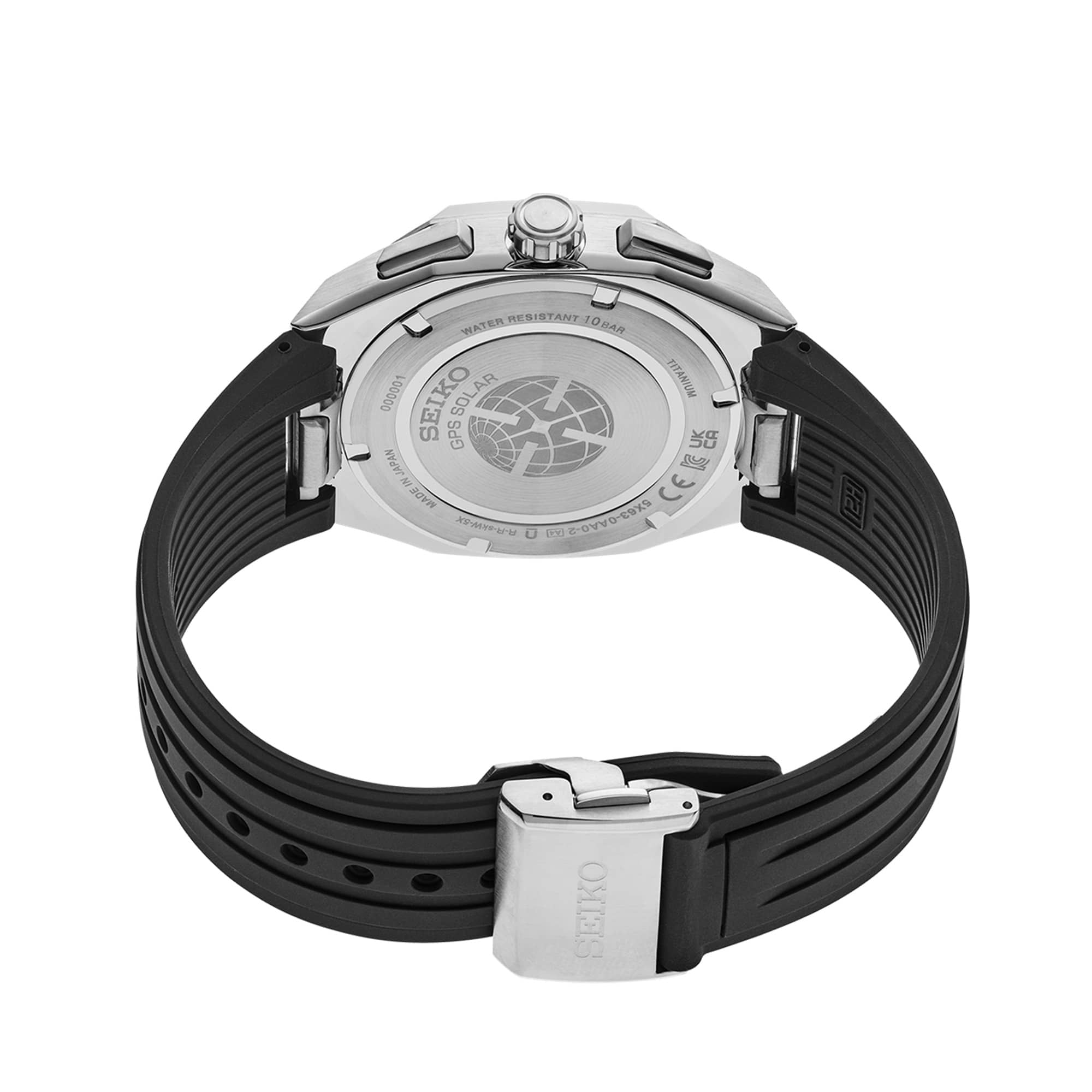 The black silicone strap connects to the case via Seiko's quick-change system, allowing tool-free strap swaps. The case back is a screwed titanium construction for secure water resistance.