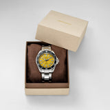 A Seiko stainless steel and silver-tone wristwatch with a bright yellow dial and black bezel, presented in an open brown box with its beige lid leaning behind on a light gray background.