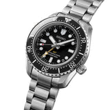 From this angle, the black ceramic bezel, clean dial finish and gold-tone GMT hand are visible together against the mirror-finished case profile.