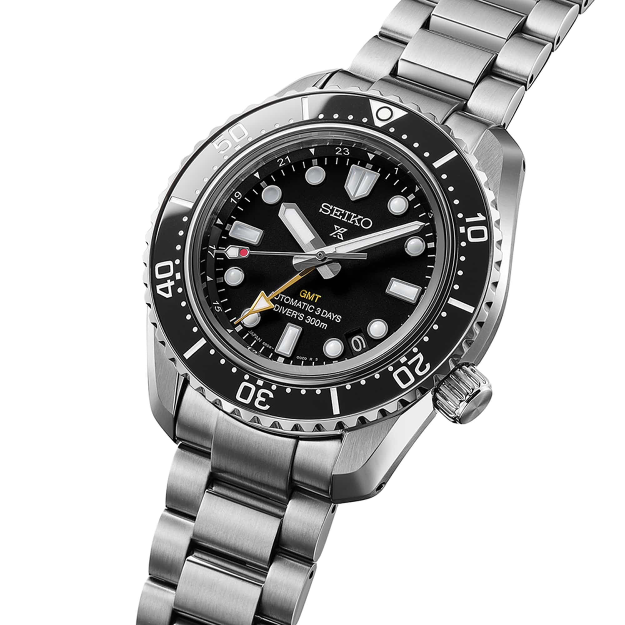 From this angle, the black ceramic bezel, clean dial finish and gold-tone GMT hand are visible together against the mirror-finished case profile.
