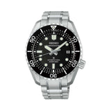 The Seiko Prospex Marinemaster HBF001J features a textured black dial with "MARINEMASTER" branding, LumiBrite hands and indices, and a date window. The 42.60mm stainless steel case is fitted with a black ceramic unidirectional bezel.