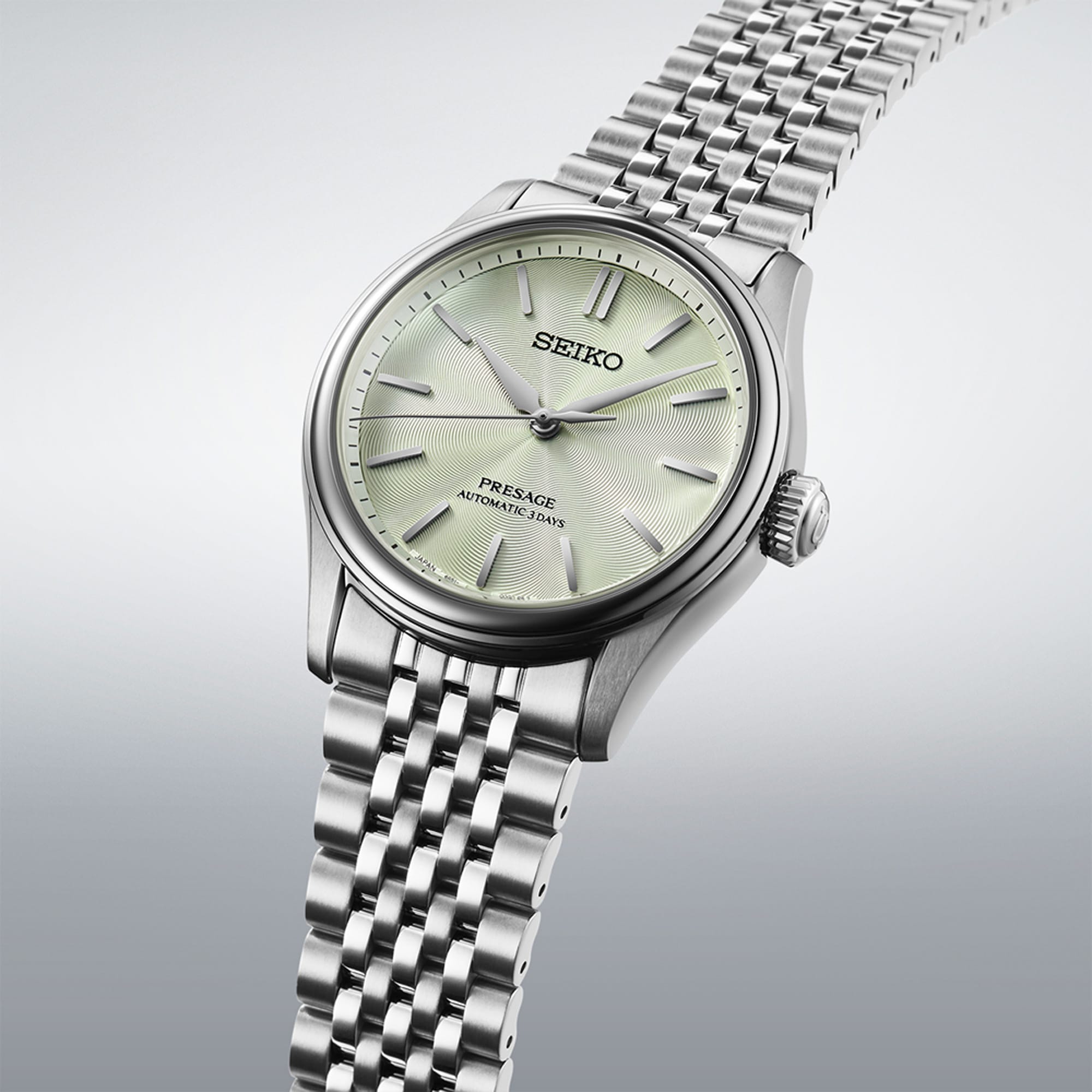From this angle, the Seiko Presage Automatic 38mm Watch HCC002J shows the green dial's textured depth together with the polished stainless steel case and bracelet.