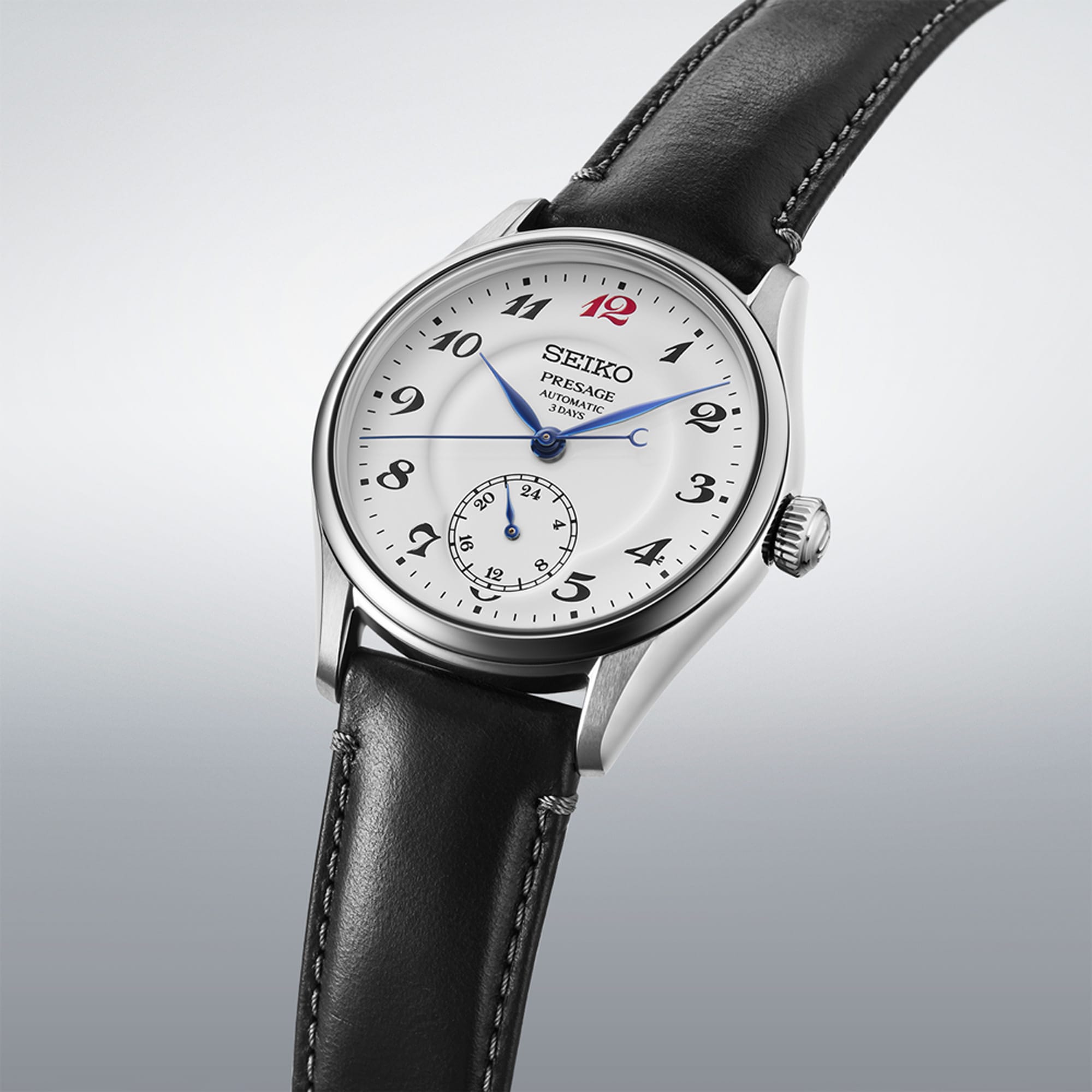 From this angle, the Seiko Presage Automatic 39.60mm Watch HCC005J shows the white enamel dial's depth and the red "12" marker together with the leather strap and stainless steel case.