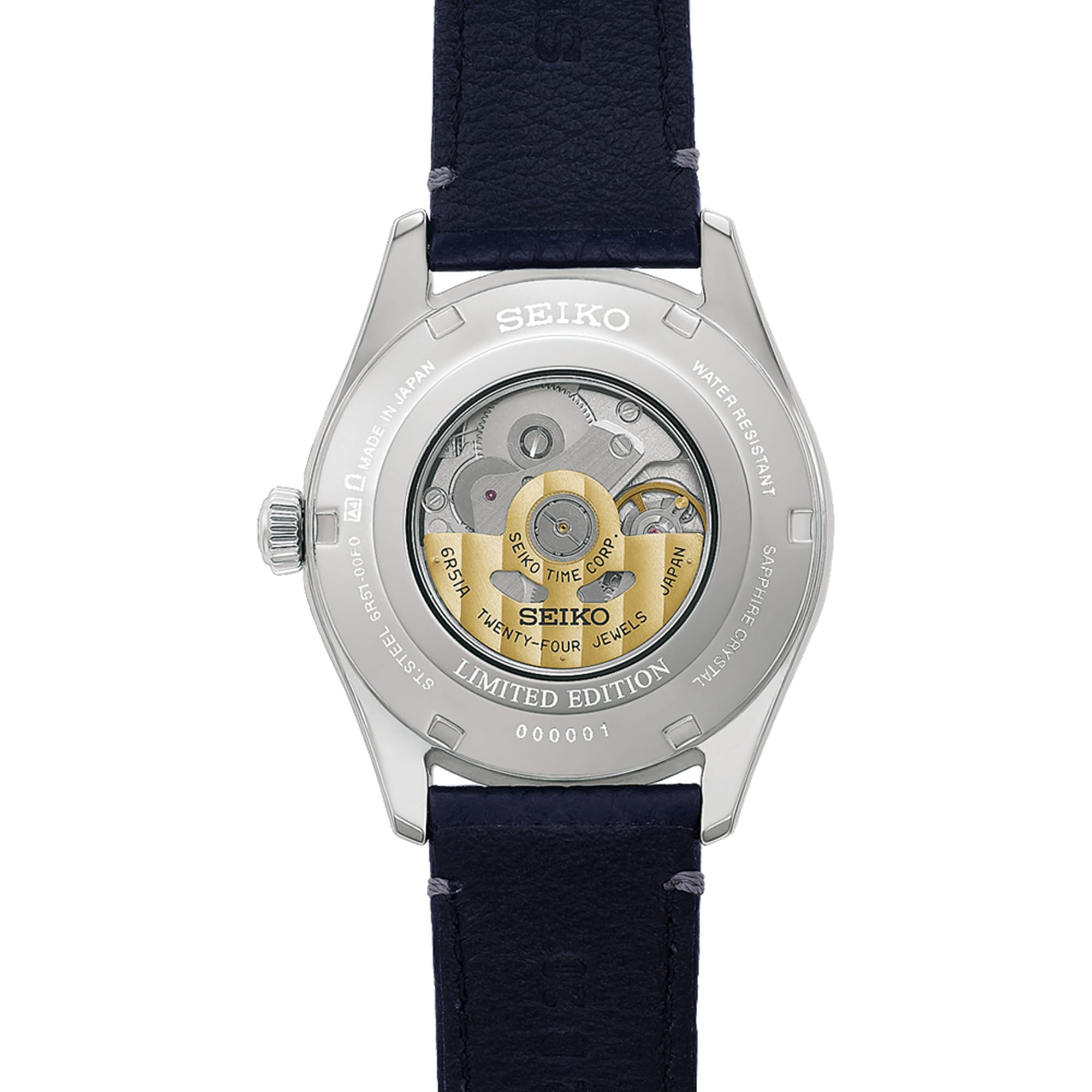 The Seiko Presage 145th Anniversary Automatic 39.60mm Men's Watch HCC007J is fitted with a leather strap secured by a three-fold clasp with push-button release. The see-through sapphire case back reveals the automatic Calibre 6R51 movement.