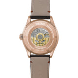 The Seiko Presage Automatic 38mm Watch HCC008J is fitted with a dark brown leather strap. The screw-down, see-through case back reveals the automatic Calibre 6R51 movement and an individually engraved serial number.