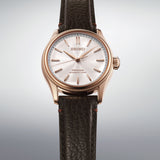 The Seiko Presage Automatic 38mm Watch HCC008J reveals the dial's pearl-painted texture and dramatic wave pattern in close detail.