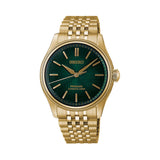 The Seiko Presage Automatic 38mm Watch HCC009J features a textured matsuba-iro green dial with gold-toned applied indexes and alpha-shaped hands. The 38mm gold-coloured PVD-coated case is fitted with domed sapphire crystal.