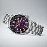 The Seiko 5 Sports SKX Series Automatic Men's 42.50mm Watch HDB003K reveals the dial's Edo purple colouring and gold logo detailing in close-up.