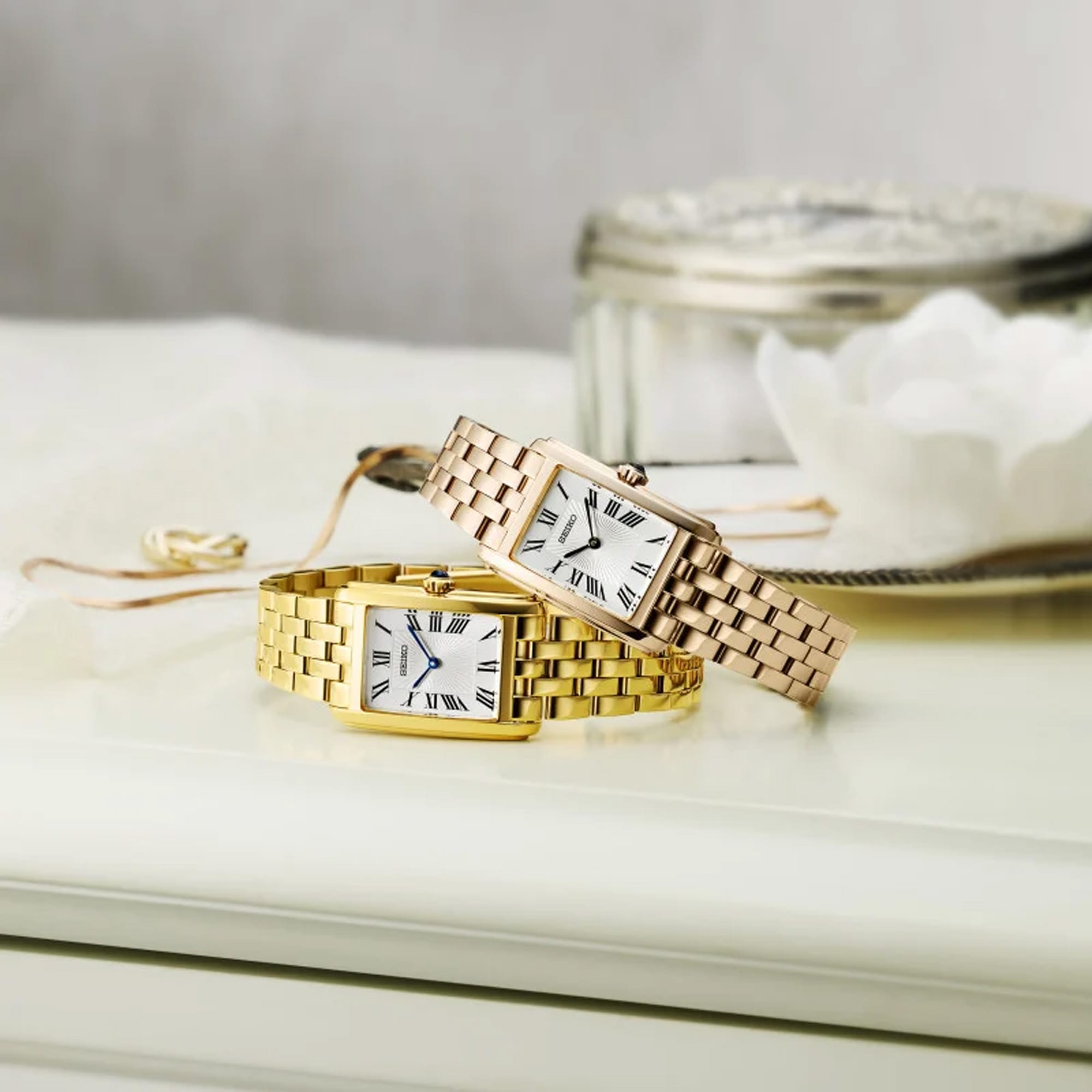 From this angle, the Seiko Conceptual Quartz 22.20mm Women's Watch HGG001P shows the dial's patterned texture and Roman numerals together with the polished gold-tone case and bracelet.