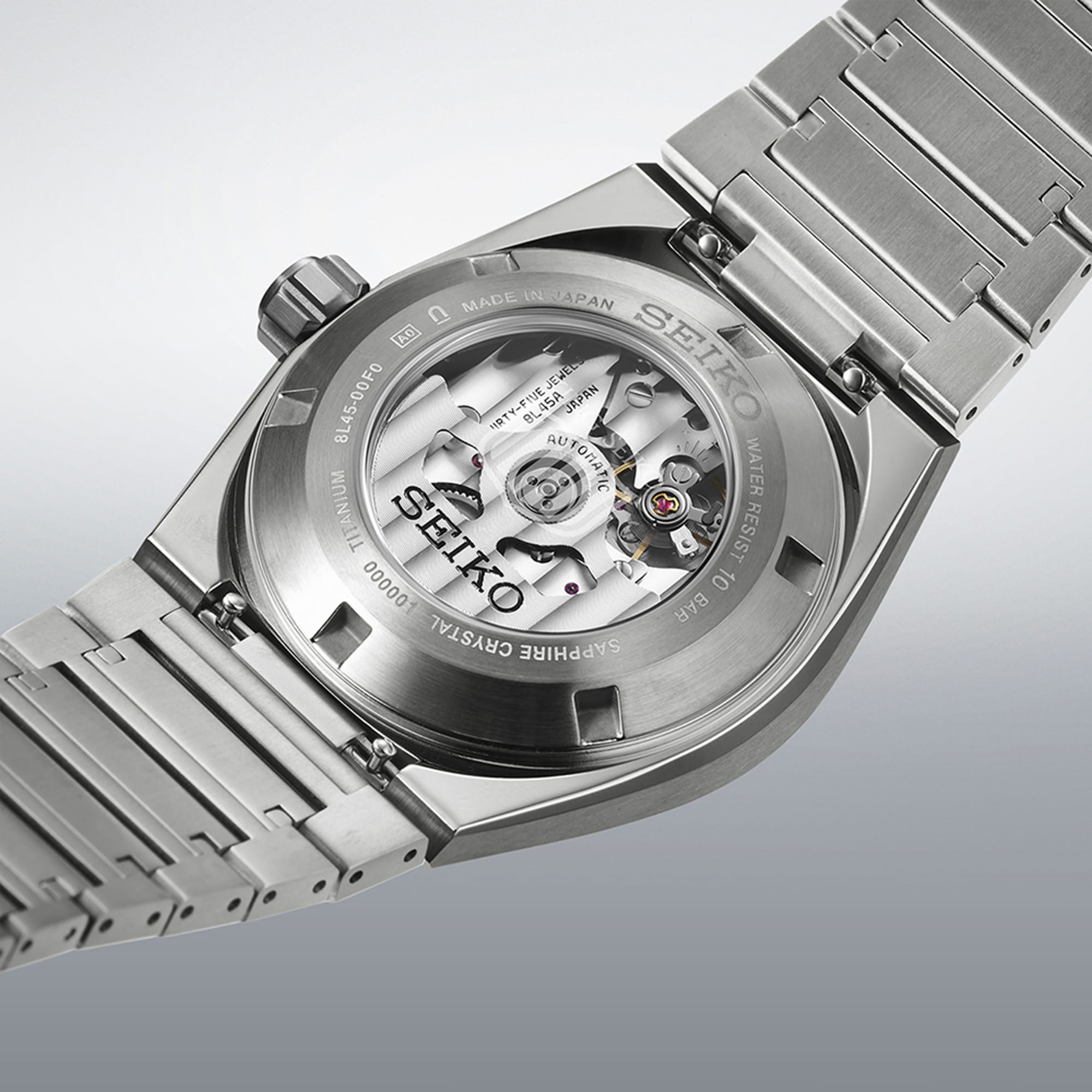 The King Seiko VANAC Automatic 41mm Men's Watch HKF002J is fitted with a titanium bracelet secured by a three-fold clasp with push-button release. The see-through, screw-down case back reveals the automatic Calibre 8L45 movement.