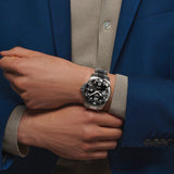 The Longines HydroConquest Automatic Men's 43mm Watch L3.782.4.56.6 worn on the wrist, showing its bold sports watch presence. The black dial, ceramic bezel and stainless steel bracelet suit both diving and everyday wear.