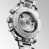 Back view of the Longines Spirit Flyback Automatic Chronograph Men's 42mm Watch L3.821.4.93.6, showing its sapphire crystal case back secured with six screws. The case back shows the exclusive L791 automatic flyback chronograph movement, which is COSC-certified as a chronometer.