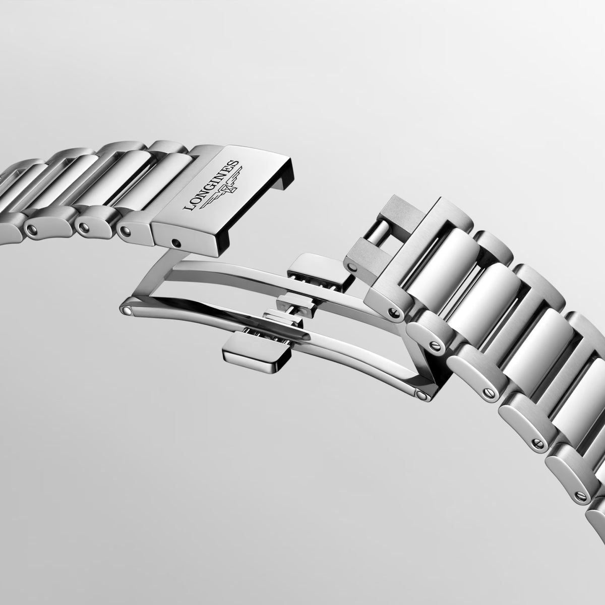 Open folding clasp on the stainless steel bracelet of the Longines Conquest Men’s 41mm Automatic Watch L3.830.4.52.6. The clasp is shown unfolded to display its construction and how it fastens securely on the wrist.