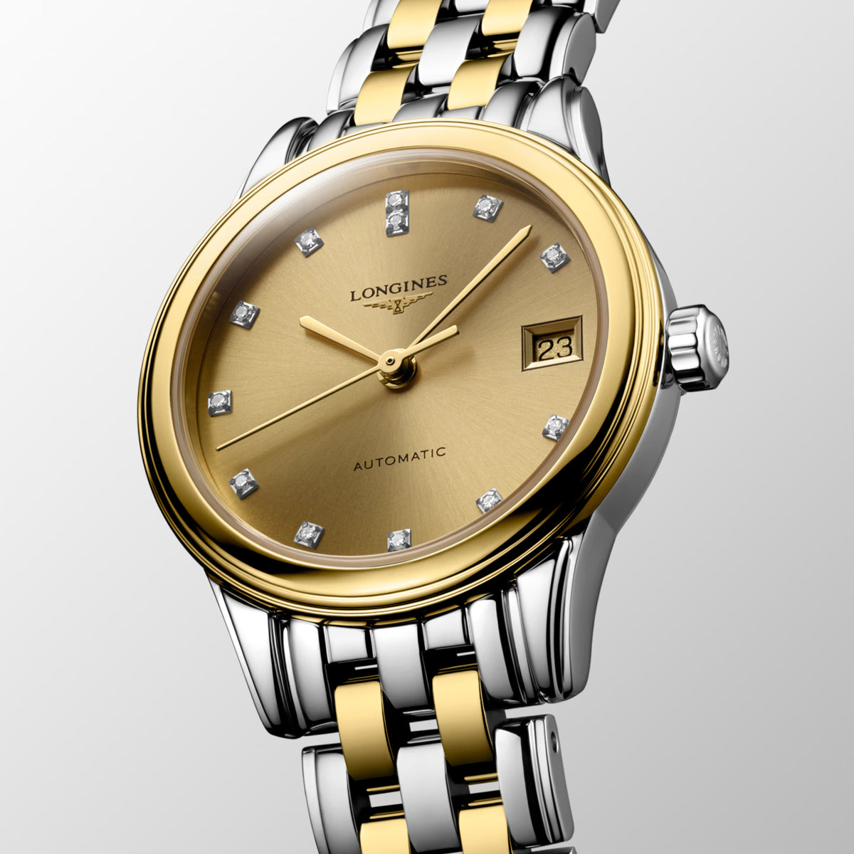 Three-quarter angle view of the Longines Flagship Classic Automatic Women’s 26mm Watch L4.274.3.37.7, showing the case profile, crown and gently curved lugs. The angle highlights the two-tone finish of the stainless steel and yellow PVD case.