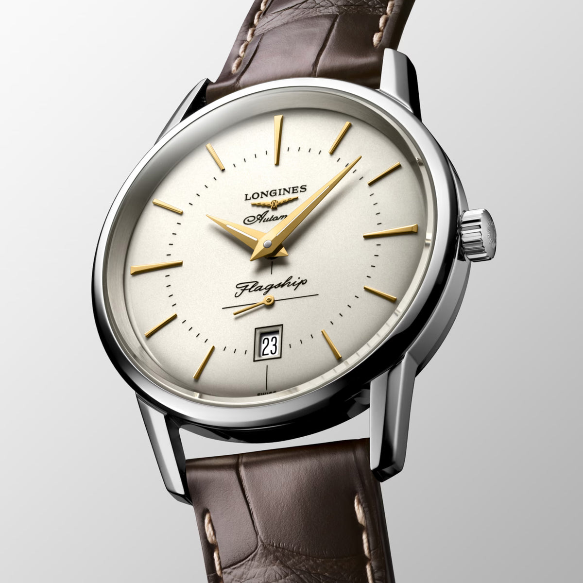 Three-quarter angle view of the Longines Heritage Flagship Automatic Men’s 38.5mm Watch L4.795.4.78.2, showing the case profile and crown. The angle highlights the polished stainless steel case and the slim, elegant lines of this vintage-inspired dress watch.