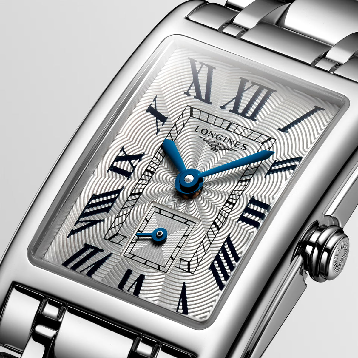 Close-up of the silver dial on the Longines DolceVita Quartz Women’s 20.5 x 32mm Watch L5.255.4.71.6, showing the Roman numerals and sword-shaped hands. The small seconds counter at 6 o’clock sits beneath scratch-resistant sapphire crystal.