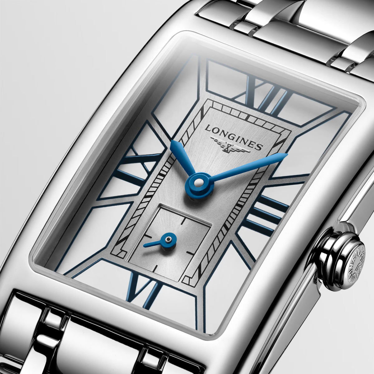 Close-up of the two-tone dial on the Longines DolceVita Quartz Women’s 20.8 x 32mm Watch L5.255.4.75.6, showing the Roman numerals at the cardinal points and sword-shaped hands. The small seconds counter at 6 o’clock sits beneath scratch-resistant sapphire crystal.