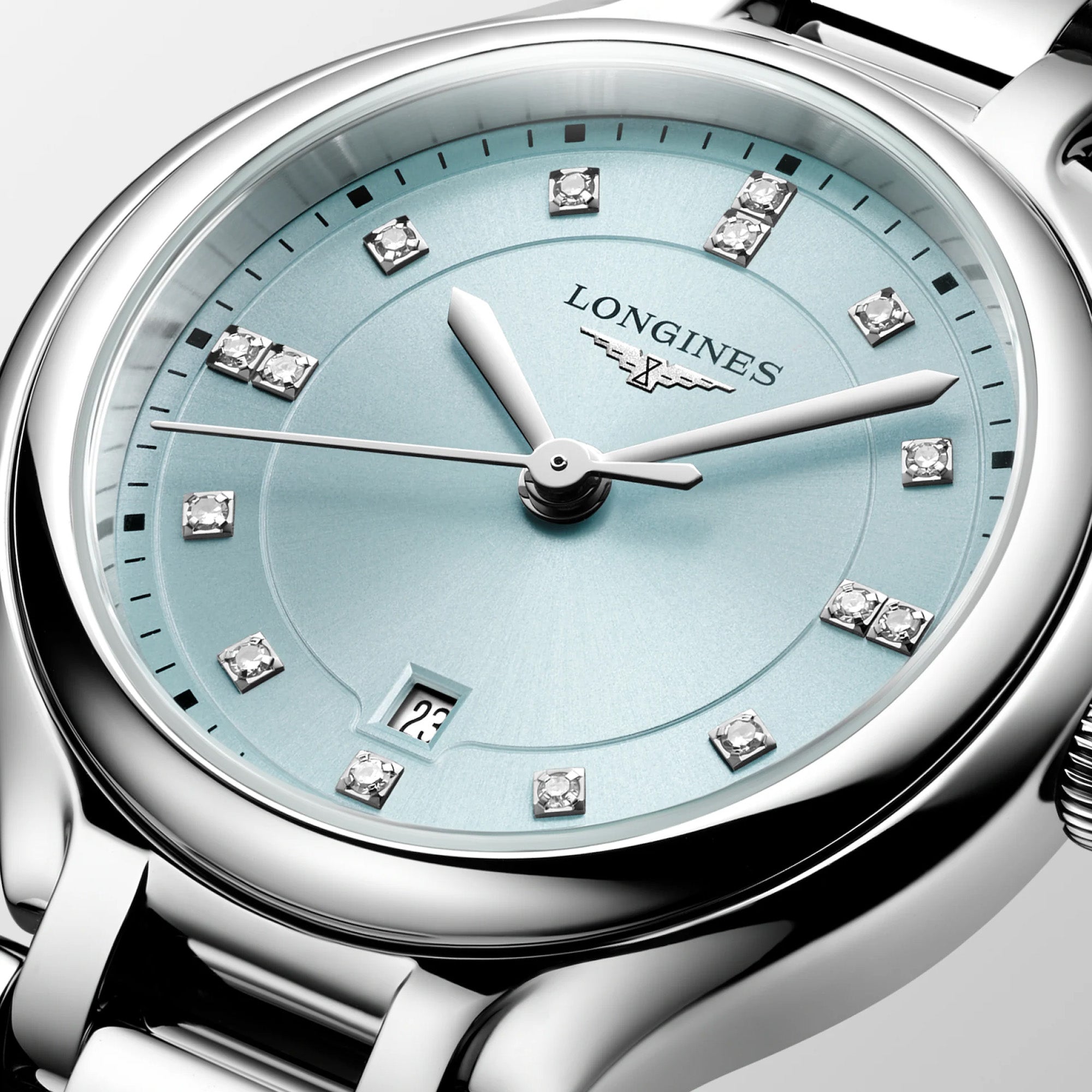 Longines PrimaLuna women’s watch featuring a polished stainless steel bracelet and 30mm round case, with a mint blue sunray dial accented by diamond hour markers, silver-tone hands, date display, and scratch-resistant sapphire crystal. Elegant Swiss luxury timepiece with refined feminine styling.