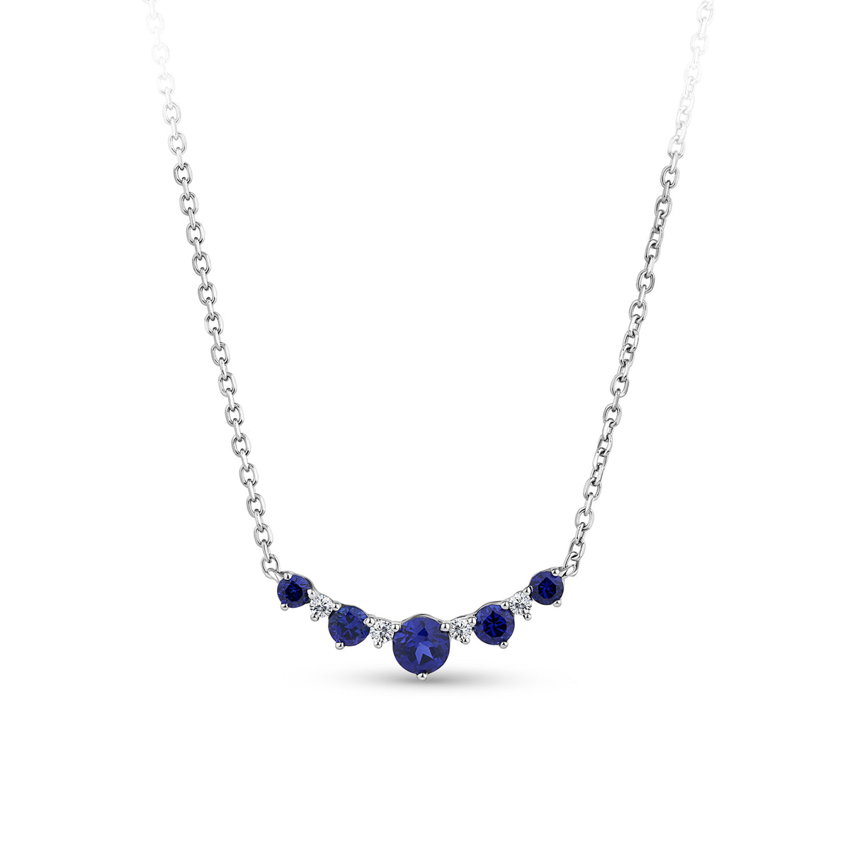 Front-on view of the Wallace Bishop 0.04 TDW Created Sapphire & Lab-Grown Diamond Chevron Pendant in Sterling Silver, reference LG34SAP03, on a cable chain with a parrot clasp. The pendant features a chevron-style row of claw-set round created dark blue sapphires with small round lab-grown diamonds between them, with the largest sapphire at the centre.