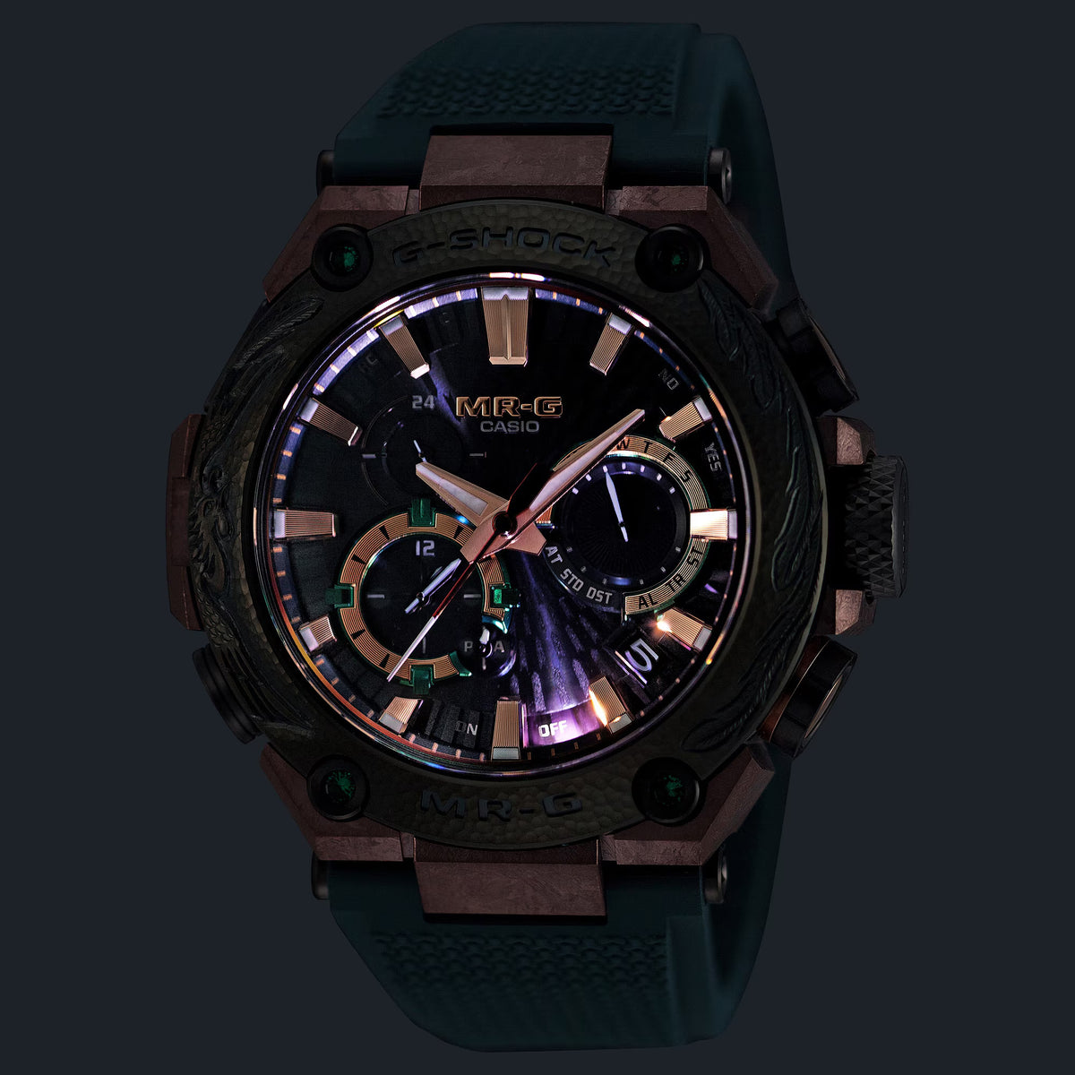 Lume display of the Casio G-SHOCK MRG-B2000KT-3A Limited Edition Men's Solar Watch, 49mm case, showing the Super Luminova-treated hands and indices in low-light conditions. The digital sub-dials remain visible alongside the glowing analogue elements.