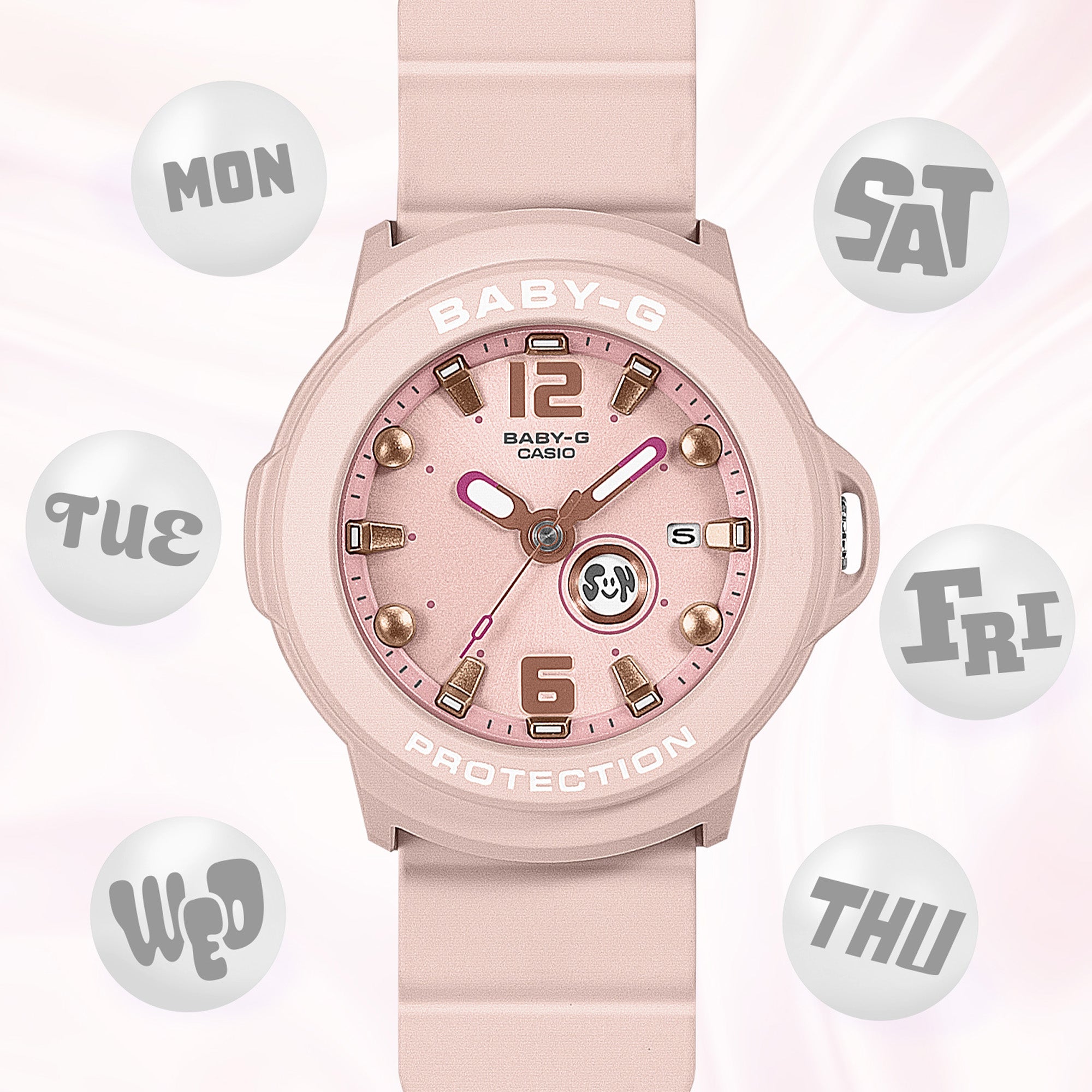 Casio Baby-G+PLUS BGA15K-4A front view, featuring the round pastel pink matte resin case with shimmering metal dial, Arabic numerals at 12 and 6 o'clock, rotating seven-design day display, three analogue hands, and matching pastel pink matte band