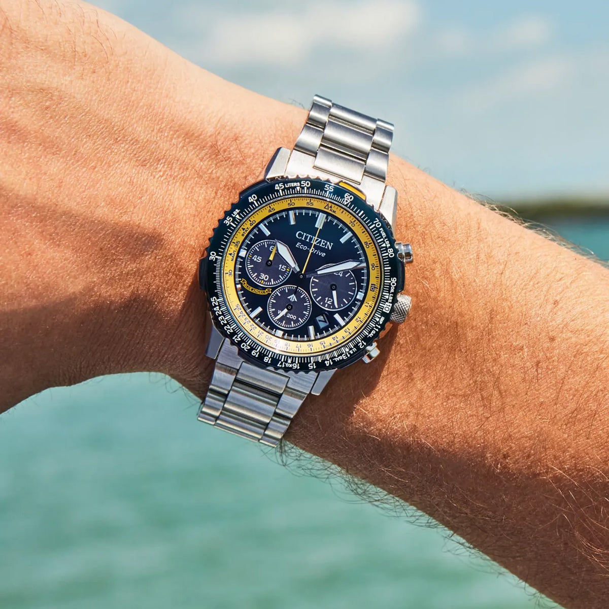 Citizen Promaster Navihawk Blue Angels Eco-Drive Chronograph Men's 40mm Stainless Steel Watch & Bracelet, Blue Dial, 200m Water Resistant CA4667-53L - on wrist in a ocean setting