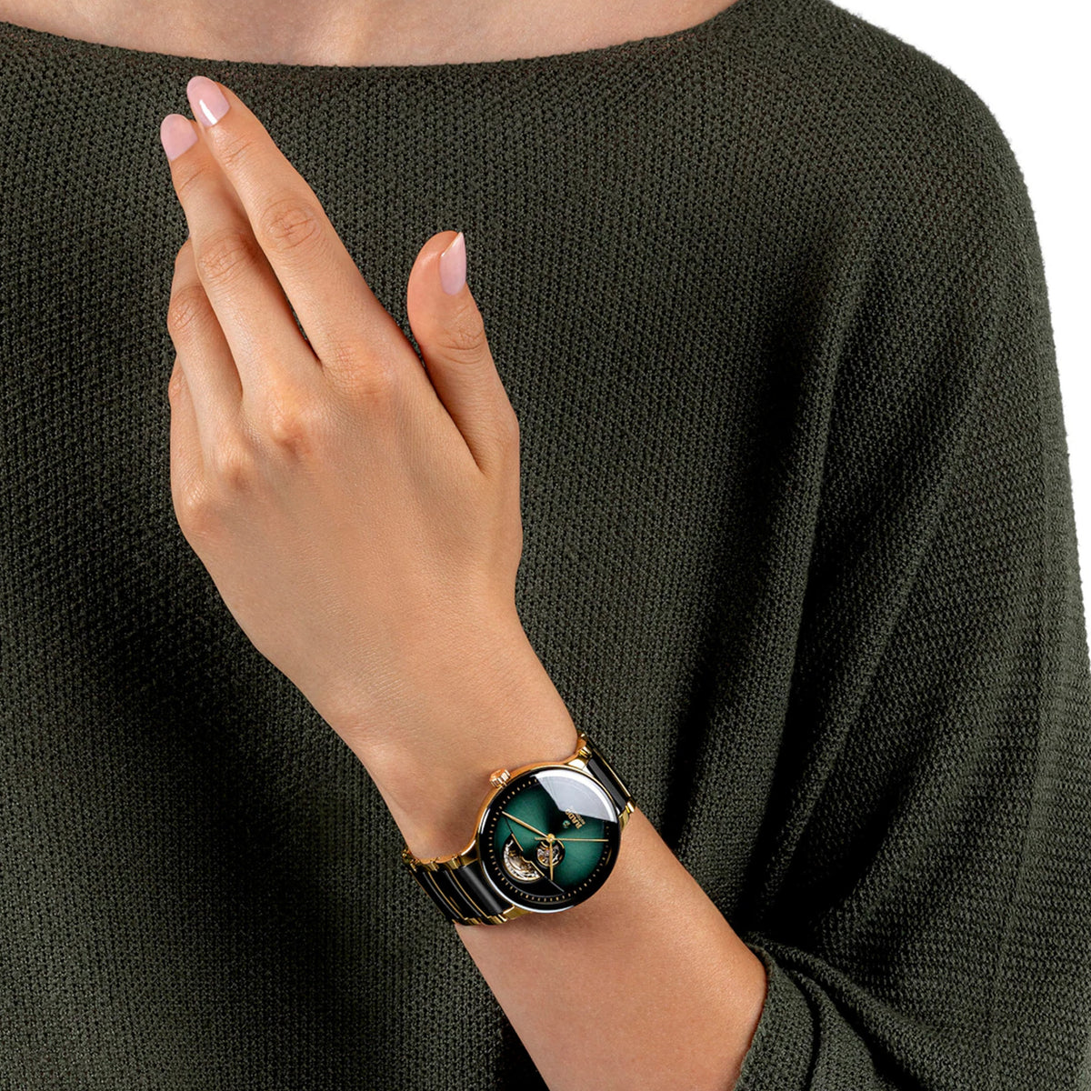 Rado Centrix Automatic Open Heart 39.5mm R30008302 worn on wrist – green gradient open heart dial, gold PVD case, gold and black ceramic bracelet, unisex 39.5mm automatic watch shown on wrist