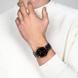 Rado Centrix Men's 39.5mm automatic watch featuring rose gold PVD stainless steel bracelet with brown high-tech ceramic details, brown dial, Sapphire Crystal, and Date Display - on wrist