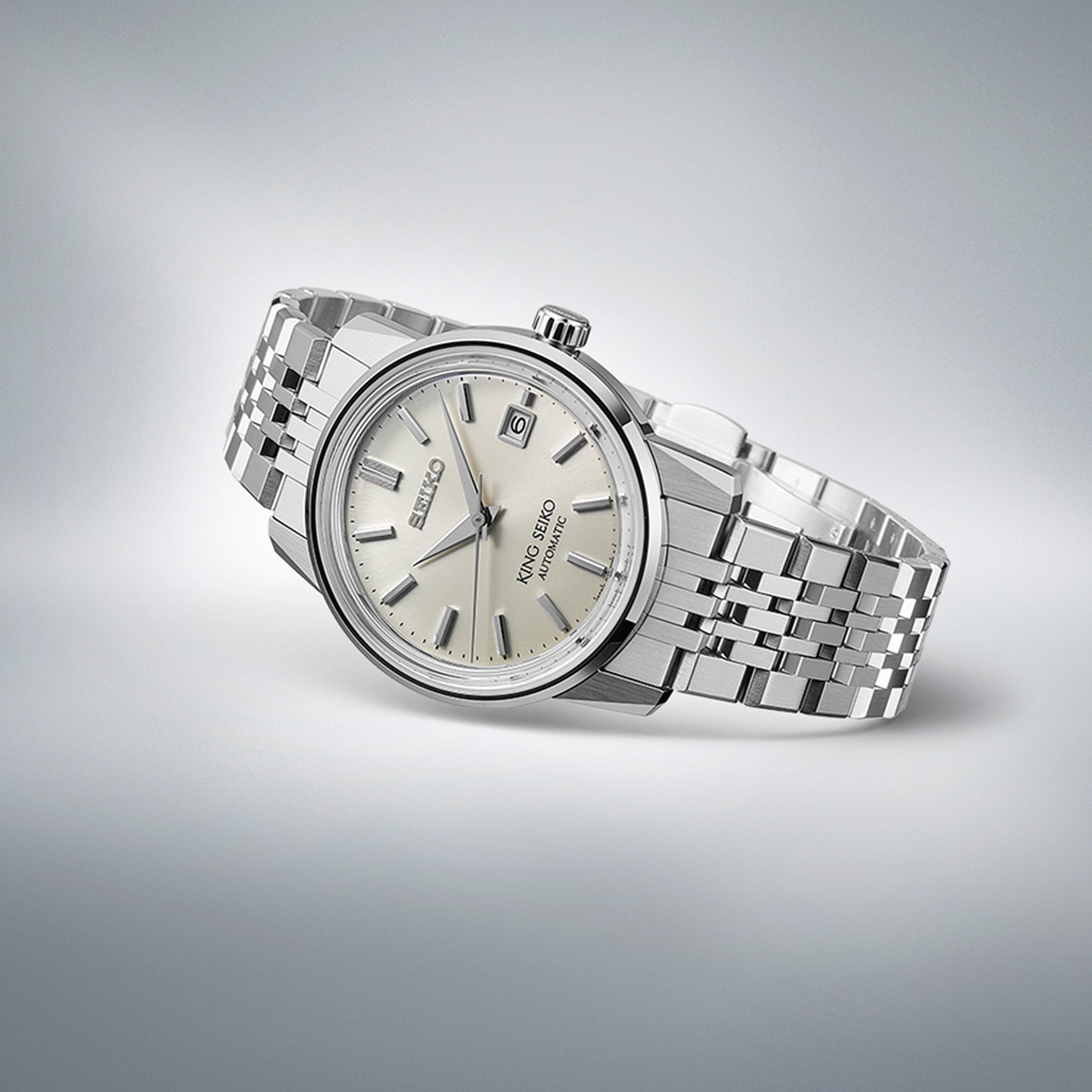 Side profile of King Seiko SJE089J showing box-shaped sapphire crystal and polished stainless steel case