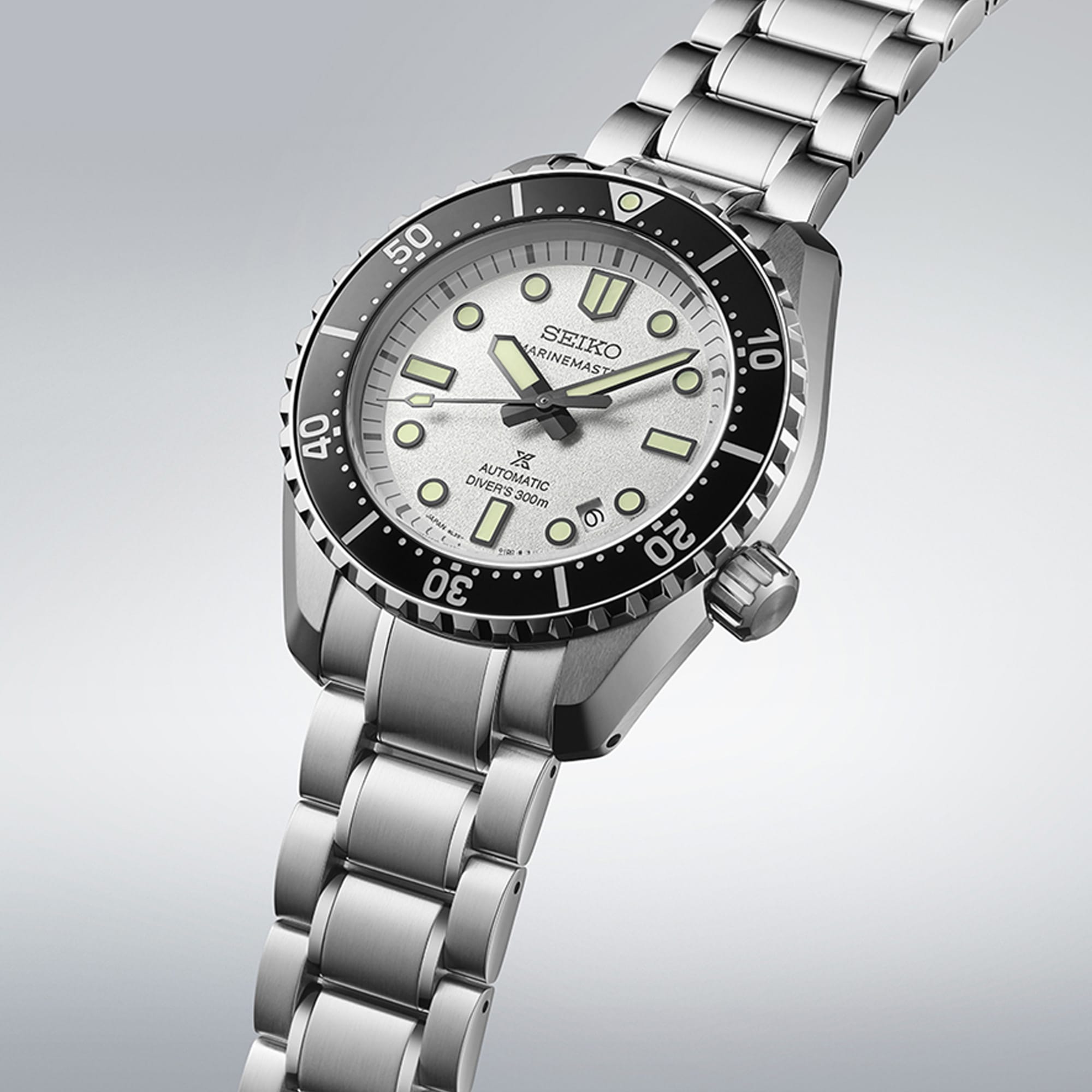 From this angle, the Seiko Prospex "Marinemaster" Automatic 42.60mm Men's Watch SLA077J shows its textured white dial, black unidirectional bezel and mixed case finishing together, showcasing the watch's heritage-inspired silhouette.