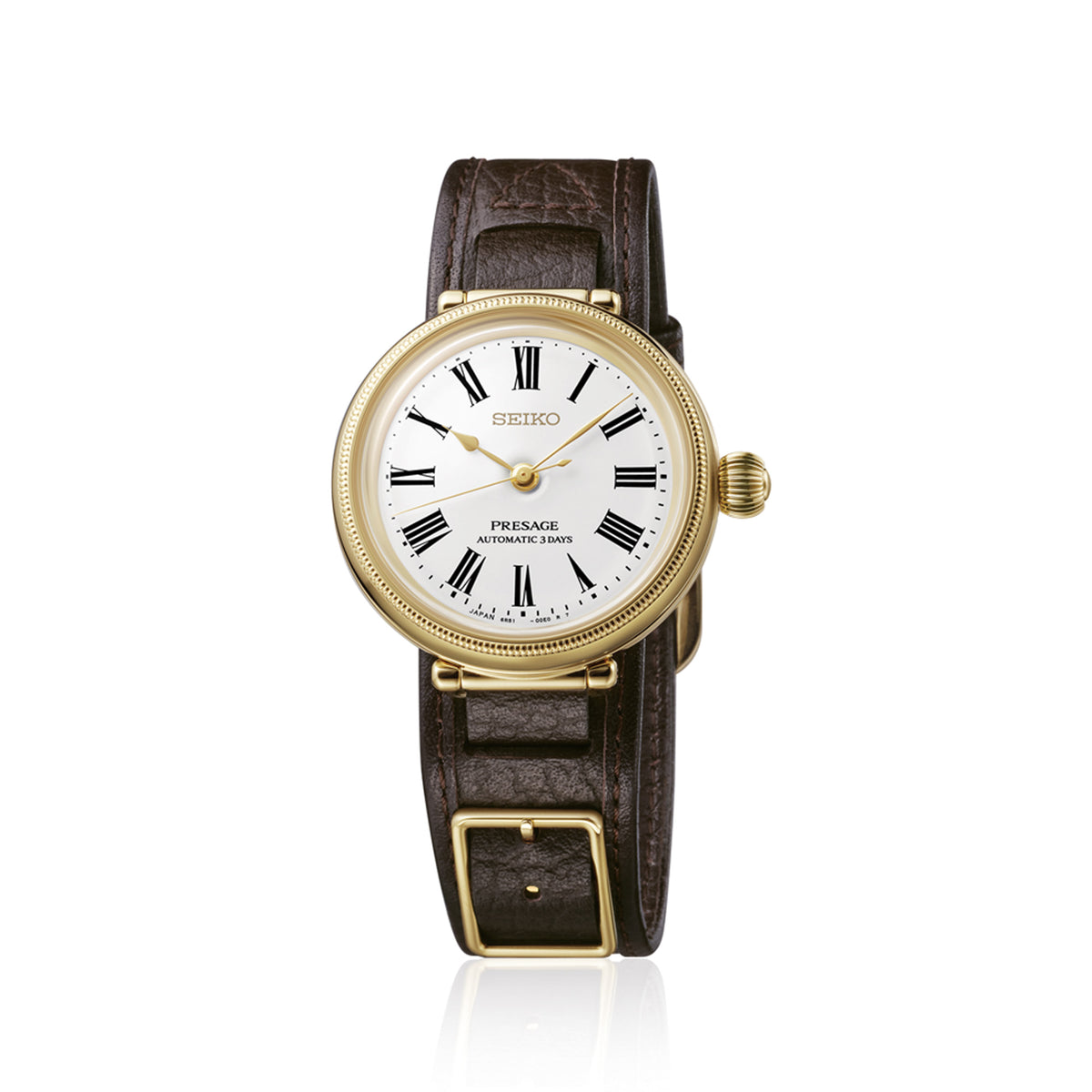 From this angle, the Seiko Presage Automatic 35mm Limited Edition Watch SPB538J shows the white enamel dial's soft depth and Roman numerals together with the gold-coloured case and leather strap.