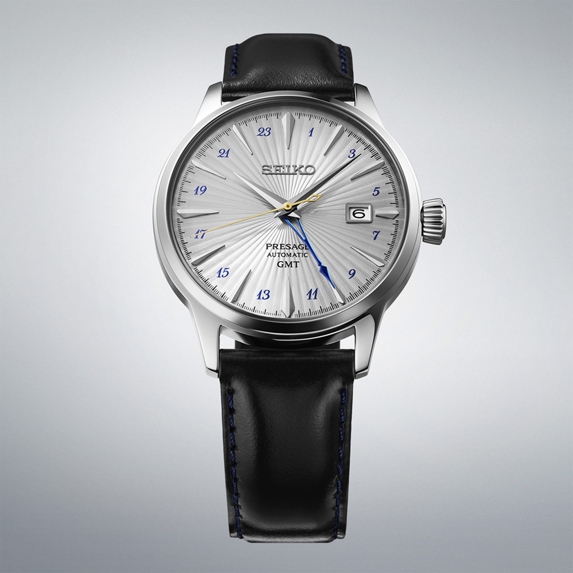 From this angle, the Seiko Presage Cocktail Time Automatic GMT Men's 40.50mm Watch SSK049J shows the grey dial's pressed texture, the navy GMT hand and the leather strap together.