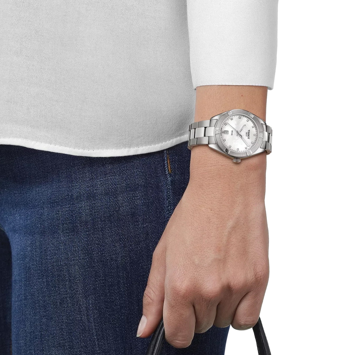 Tissot PR 100 Sport Chic 36mm T101.910.11.116.00 worn on wrist – white mother-of-pearl dial with diamond indexes, silver stainless steel case and bracelet, elegant 36mm women's quartz watch shown on wrist