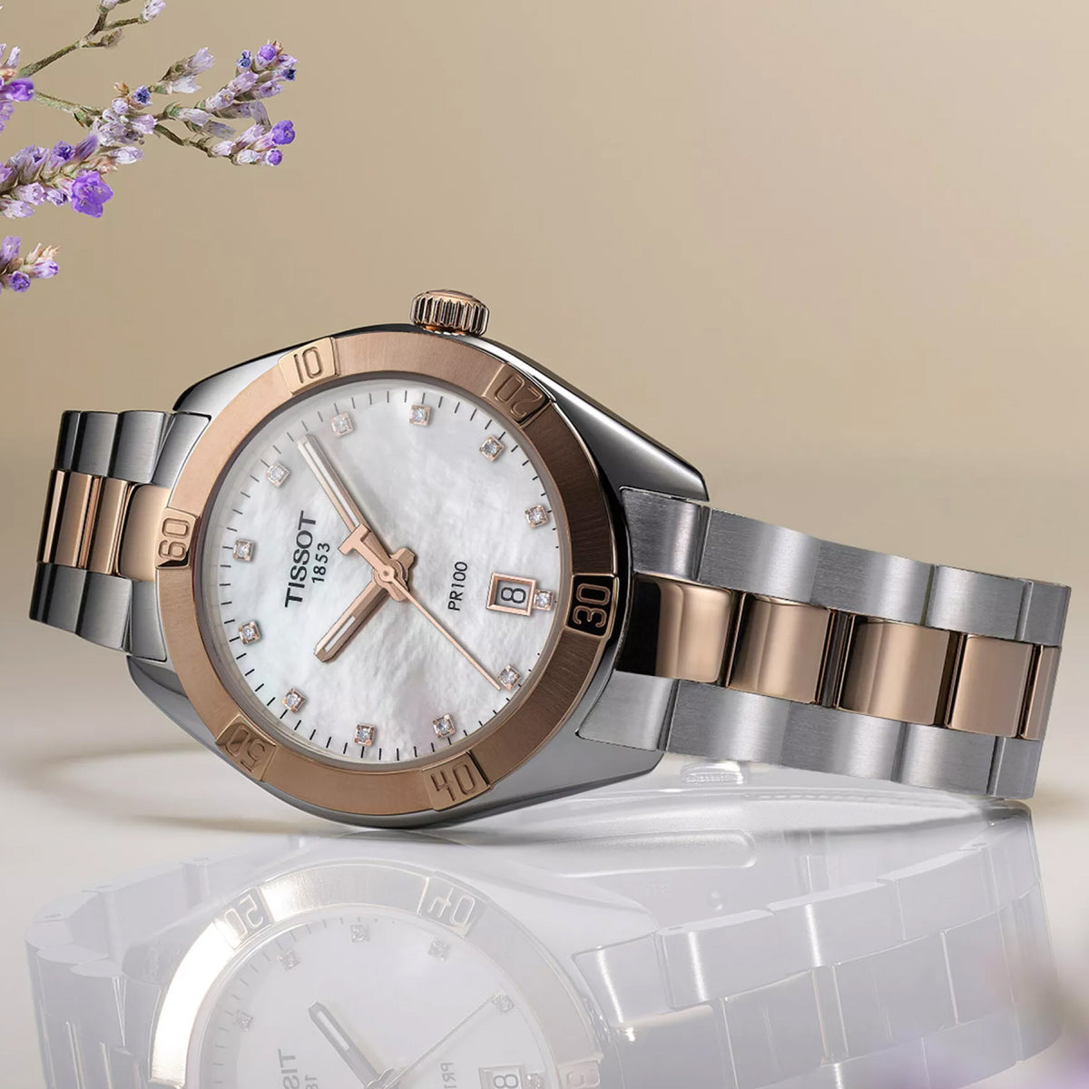 Tissot PR 100 Sport Chic 36mm T101.910.22.116.00 front view – white mother-of-pearl dial, two-tone grey and rose gold PVD stainless steel case, 12 diamond hour indexes, Super-LumiNova® hands, date window, two-tone bracelet