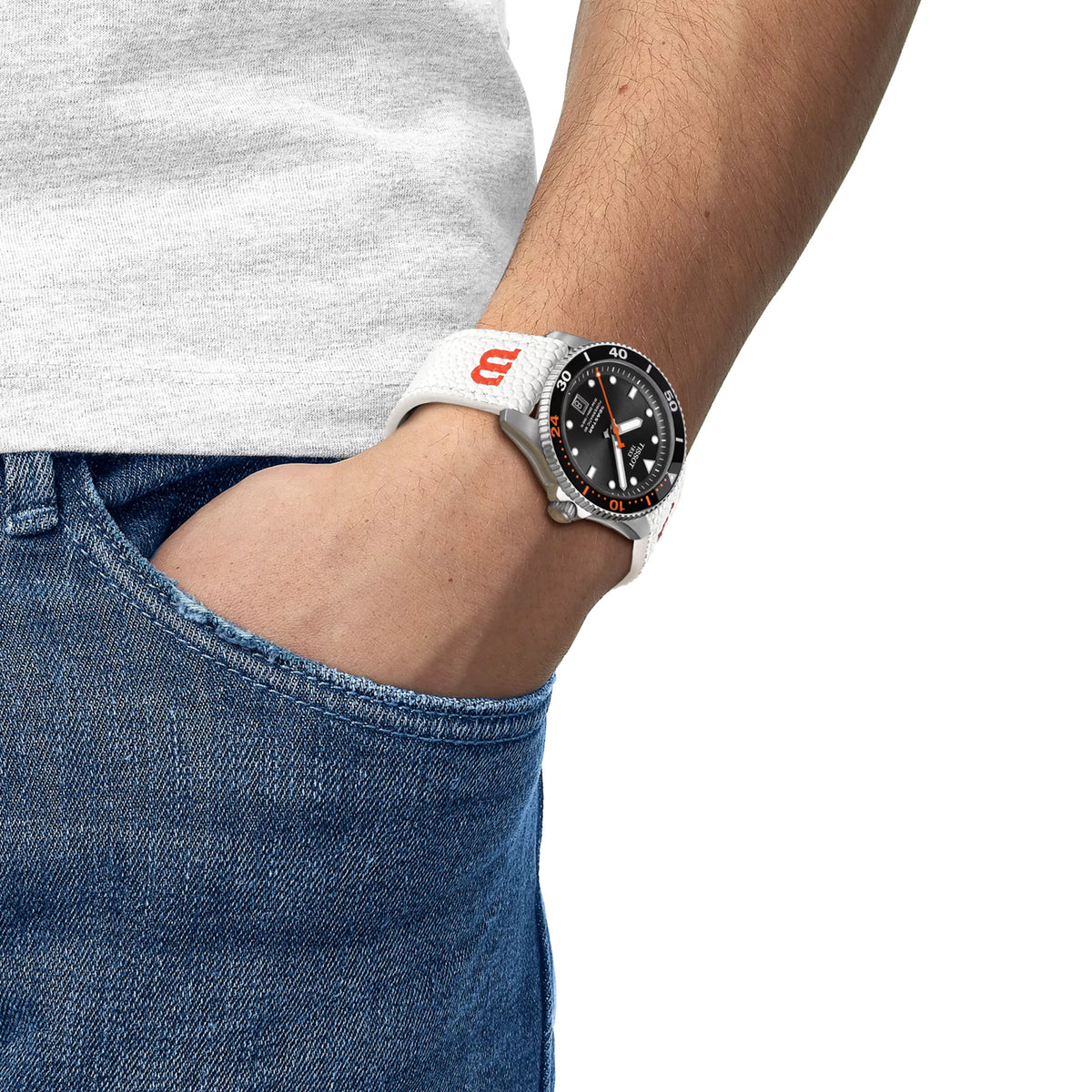 Tissot Seastar 1000 Wilson WNBA 40mm T120.807.17.051.00 worn on wrist – black dial with orange details, stainless steel case, Wilson WNBA game ball strap, bold 40mm WNBA special edition automatic shown on wrist