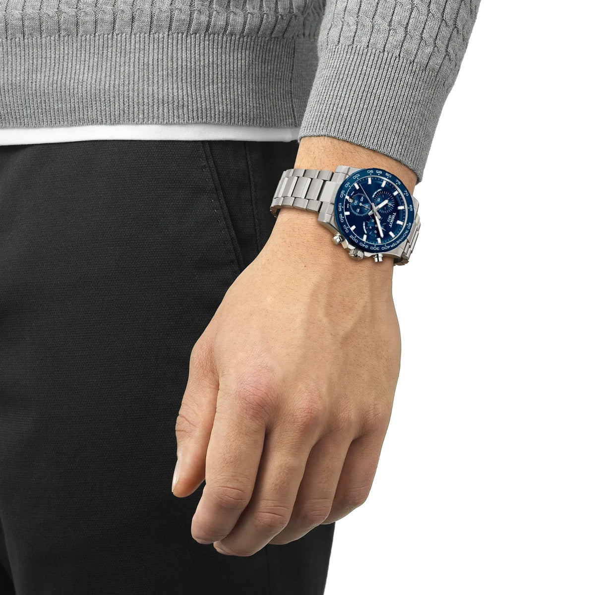 Tissot Supersport Chrono 42mm T125.417.11.041.00 worn on wrist – blue chronograph dial, stainless steel case with aluminium bezel, grey steel bracelet, bold 42mm quartz chronograph shown on wrist