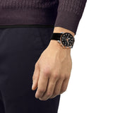 Tissot Supersport Chrono 42mm T125.417.27.051.00 worn on wrist – black chronograph dial, rose gold PVD case with aluminium bezel, silicone strap, bold 42mm quartz chronograph shown on wrist