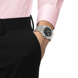 Tissot PRX Chronograph 41mm T137.417.11.051.00 worn on wrist – black chronograph dial, integrated stainless steel case and bracelet, slim 70s-inspired profile shown on wrist