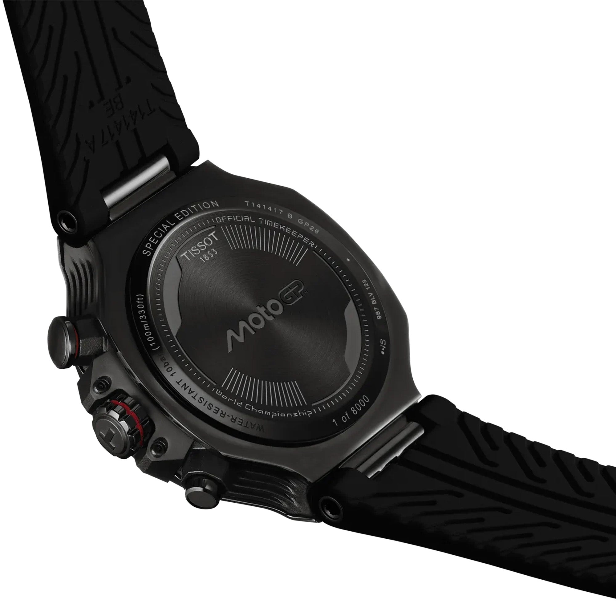Close-up of the back of a Tissot T-Race MotoGP 2026 45mm T141.417.37.422.00 watch with a textured black strap, showing the branded case and dial details on a white background.