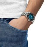 Tissot PR516 Automatic 38mm T149.407.11.041.00 front view – blue gradient dial, PVD stainless steel case, mineral bezel ring, index hour markers, date window, grey stainless steel bracelet - on wrist