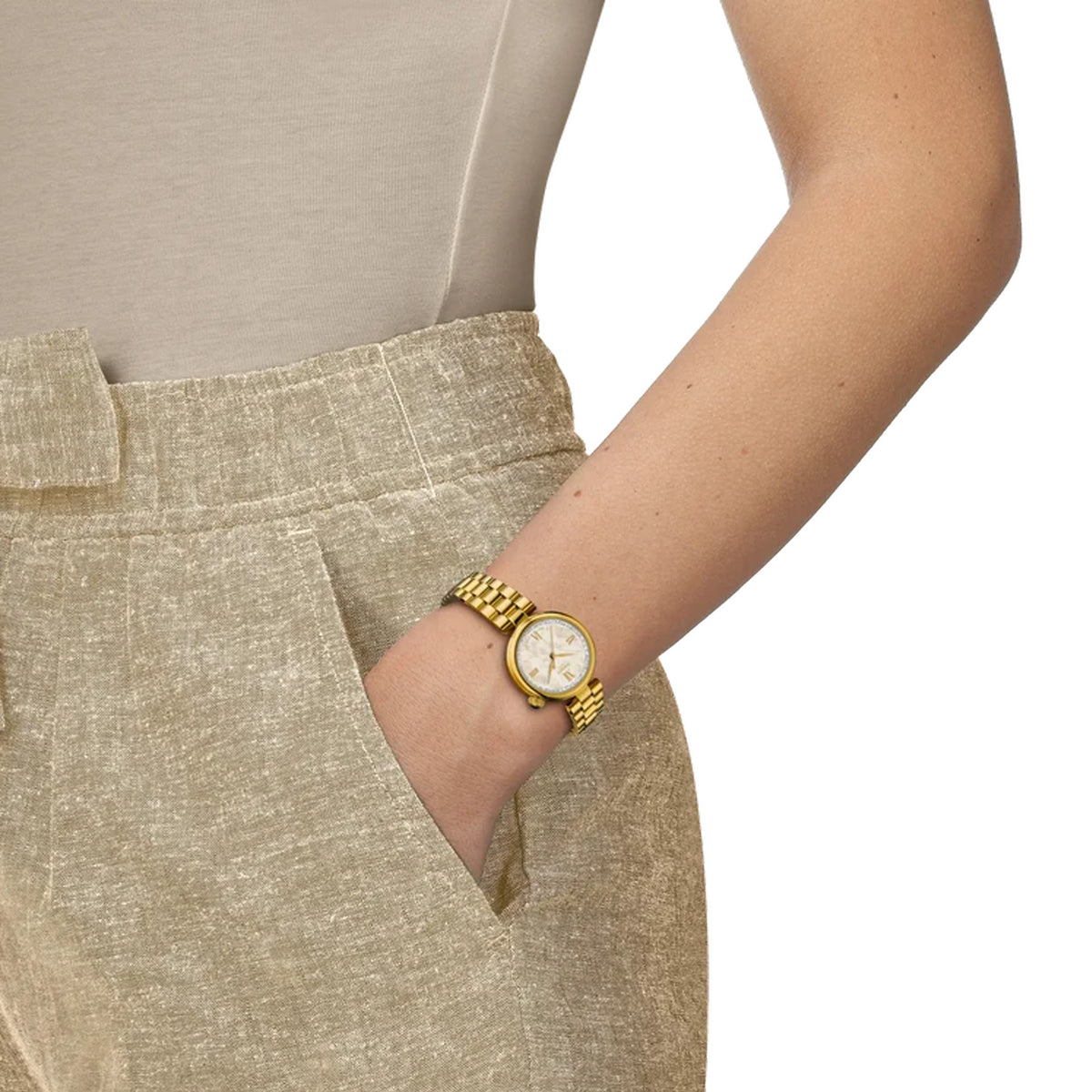 Tissot Desir 28mm T152.010.33.118.00 worn on wrist – white mother-of-pearl dial with Roman numerals, yellow gold PVD case and bracelet, elegant 28mm women’s quartz watch shown on wrist