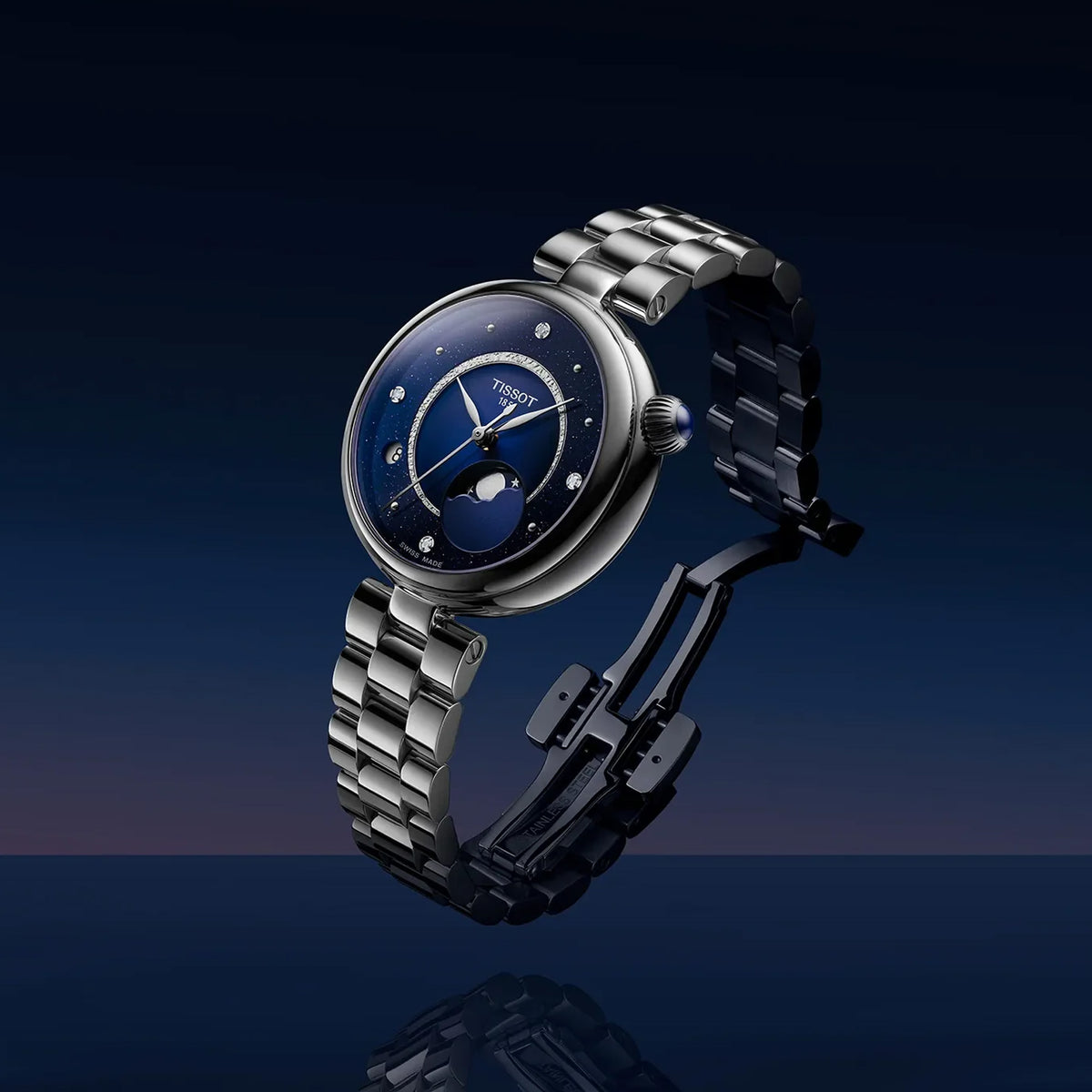 Tissot Désir 29.6mm T152.223.11.496.00 front view – blue and midnight blue dial, round stainless steel case, diamond hour indexes, moonphase display, grey stainless steel jewellery-style bracelet