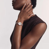 Tissot Désir 29.6mm T152.223.22.036.00 worn on wrist – silver moonphase dial with diamond indexes, rose gold and steel two-tone case and bracelet, elegant 29.6mm profile shown on wrist