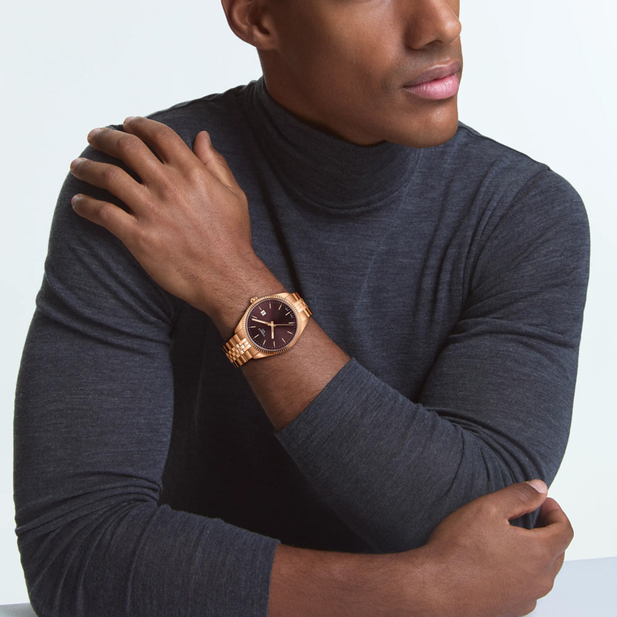 Tissot Ballade 40mm T156.410.33.371.00 worn on wrist – burgundy sunray dial, rose gold PVD case with fluted bezel, stainless steel bracelet, refined 40mm men’s quartz watch shown on wrist